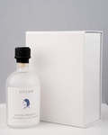 ELYZAIR Shifting Frequency bottle in frosted glass with black shrink capsule, beside the white embossed edition box